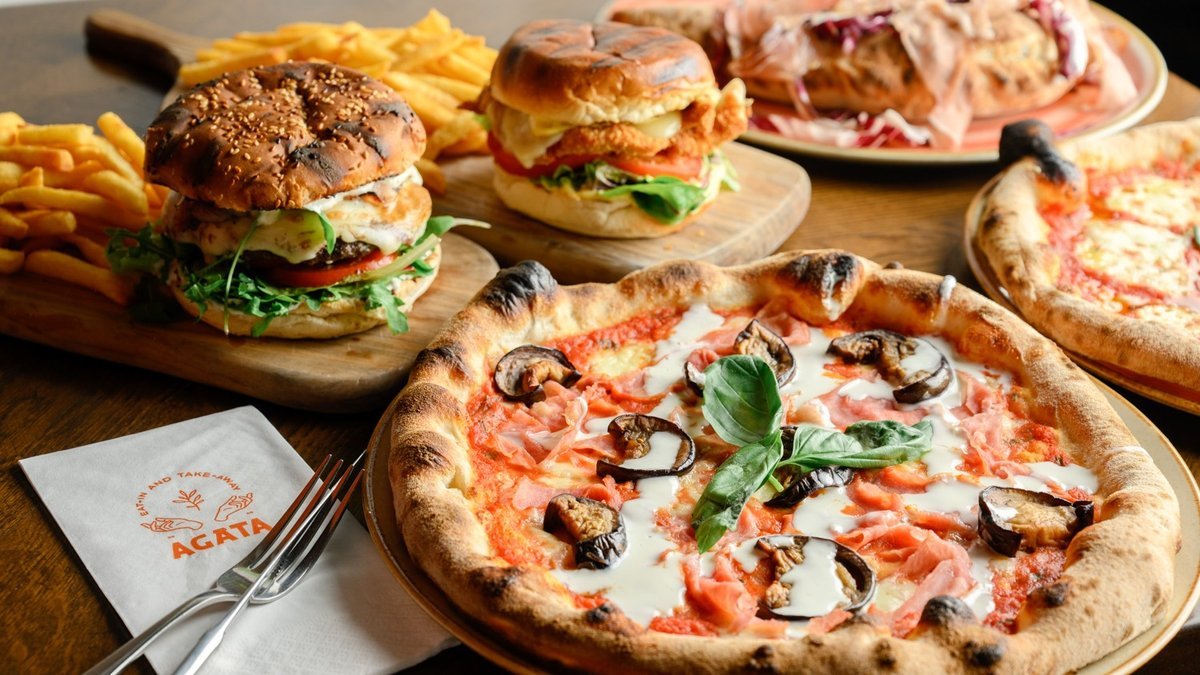 A spread of AGATA pizza and burgers